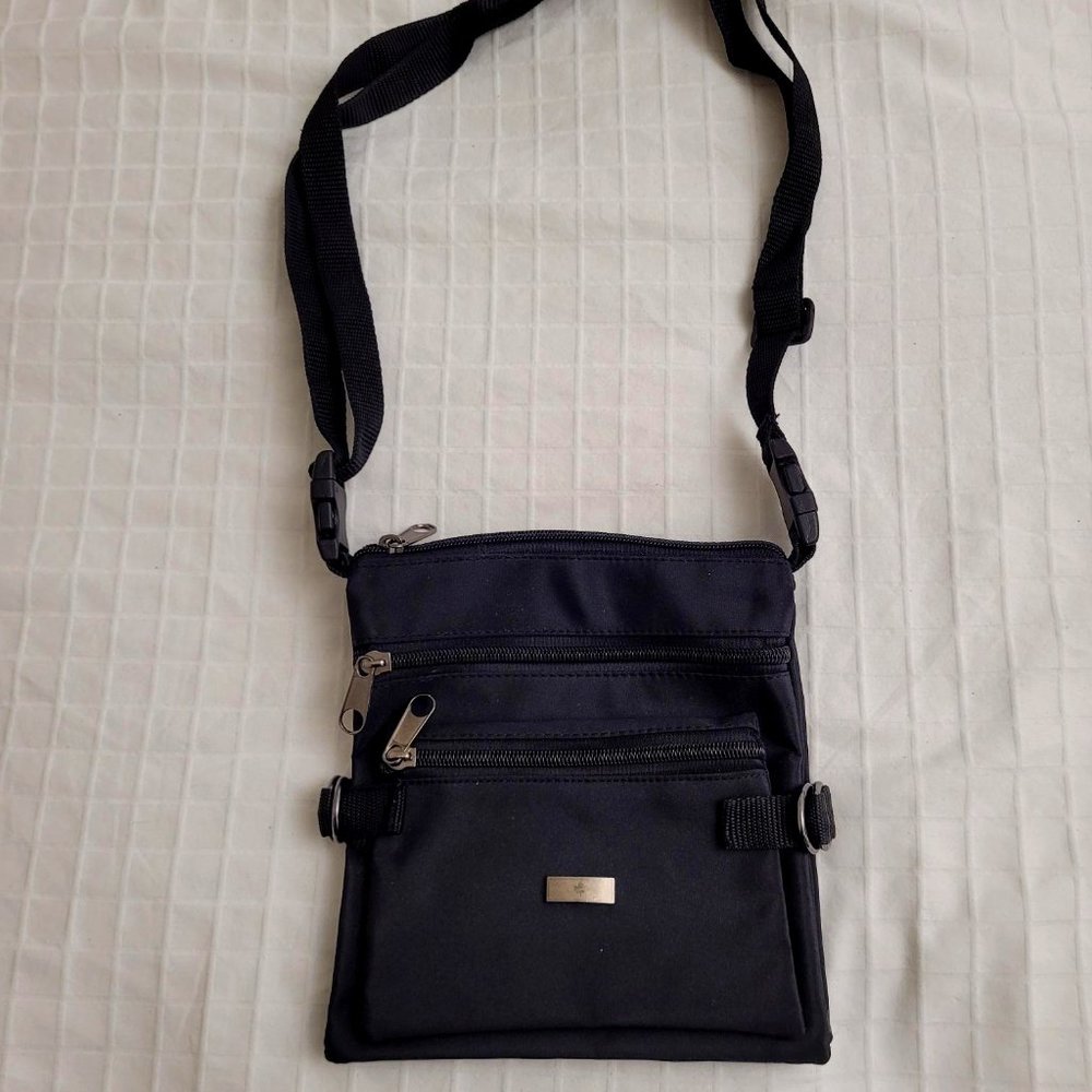 Black nylon fold out shoulder bag.